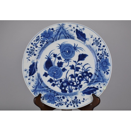 4 - A 19th Century Chinese Porcelain Blue and White Plate Decorated in a Floral Motif, the back with Blo... 