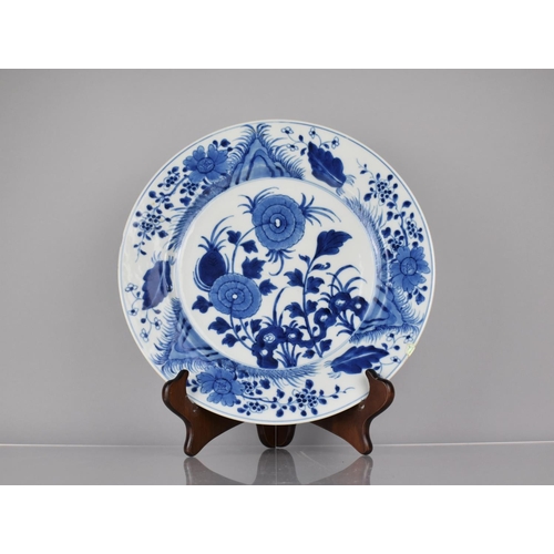 4 - A 19th Century Chinese Porcelain Blue and White Plate Decorated in a Floral Motif, the back with Blo... 