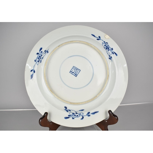 4 - A 19th Century Chinese Porcelain Blue and White Plate Decorated in a Floral Motif, the back with Blo... 