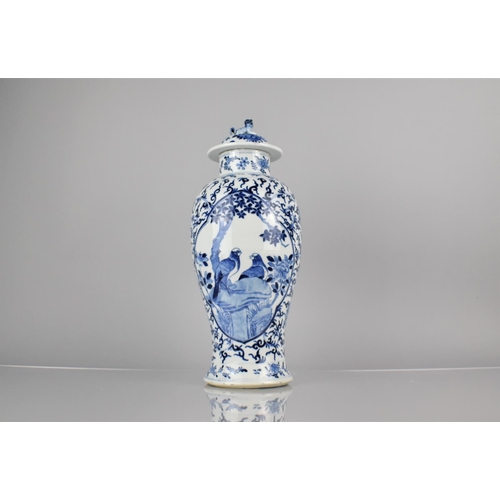 19 - A 19th Century Chinese Porcelain Blue and White Baluster Vase and Cover Decorated with Quatrefoil Ca... 