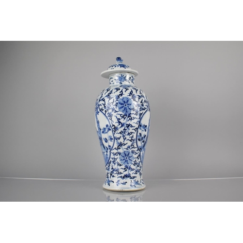 19 - A 19th Century Chinese Porcelain Blue and White Baluster Vase and Cover Decorated with Quatrefoil Ca... 