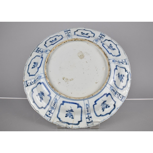 10 - An Early Chinese Porcelain, Probably Kangxi Period (1662-1722) Blue and White Plate Decorated with C... 