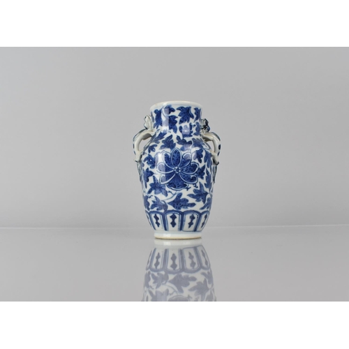 21 - A 19th Century Chinese Porcelain Blue and White Vase decorated with Central Flower Motif Amongst Fol... 