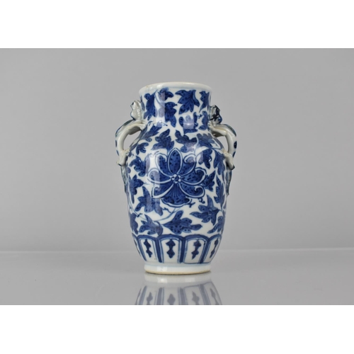 21 - A 19th Century Chinese Porcelain Blue and White Vase decorated with Central Flower Motif Amongst Fol... 