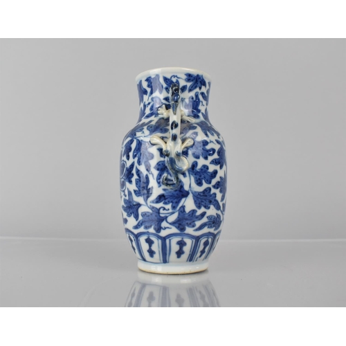 21 - A 19th Century Chinese Porcelain Blue and White Vase decorated with Central Flower Motif Amongst Fol... 