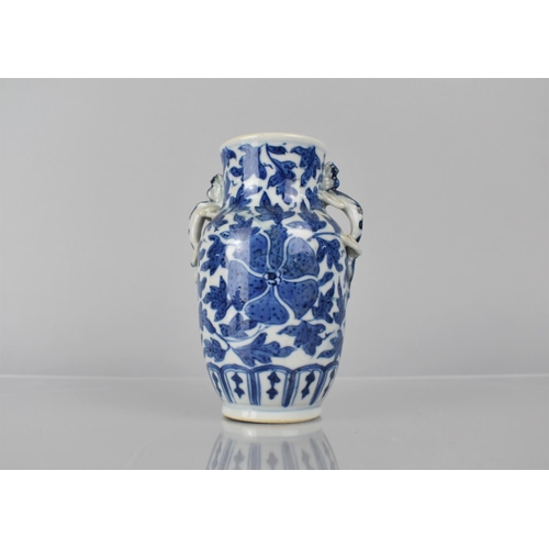 21 - A 19th Century Chinese Porcelain Blue and White Vase decorated with Central Flower Motif Amongst Fol... 