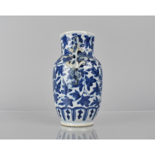 21 - A 19th Century Chinese Porcelain Blue and White Vase decorated with Central Flower Motif Amongst Fol... 