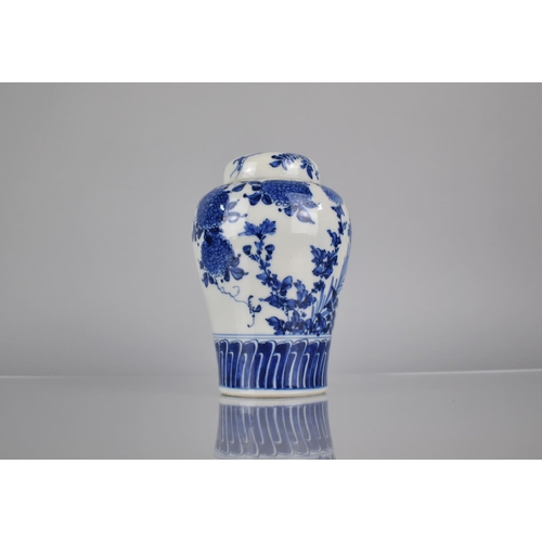 20 - A 20th Century Oriental Blue and White Porcelain Jar and Cover of Baluster Form decorated in a Flora... 