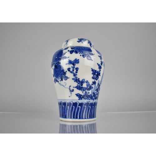 20 - A 20th Century Oriental Blue and White Porcelain Jar and Cover of Baluster Form decorated in a Flora... 