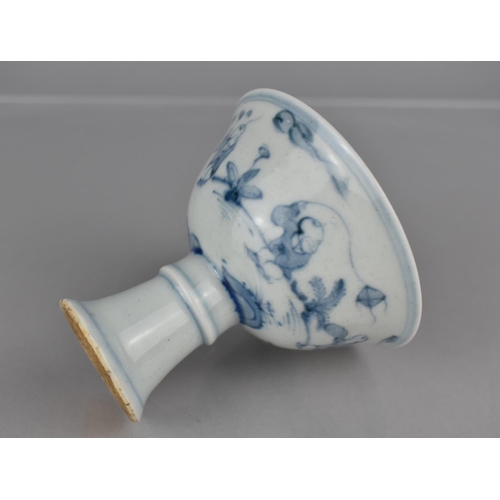 38 - A Chinese Porcelain Blue and White Stem Cup decorated with Children at Play in Garden Setting, 8cms ... 