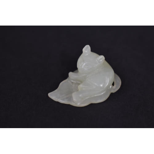 140 - A Chinese White Jade Pebble Carving of Cat Seated on Leaf, 3cms by 1cms High