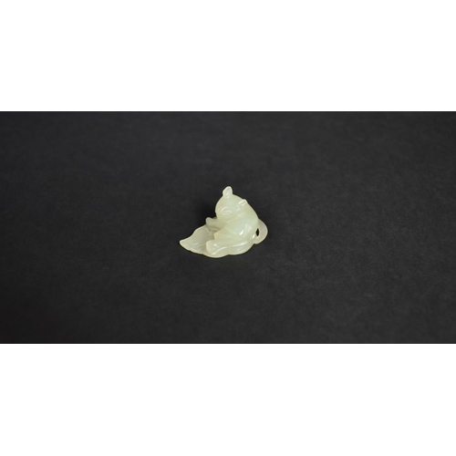 140 - A Chinese White Jade Pebble Carving of Cat Seated on Leaf, 3cms by 1cms High