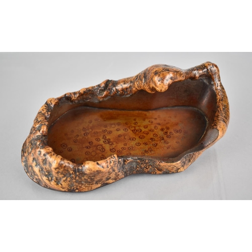 143 - A Japanese Burr and Gilt Speckled Lacquered Dish of Organic Form, 21cms by 11cms by 8cms HIgh