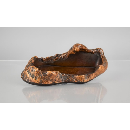 143 - A Japanese Burr and Gilt Speckled Lacquered Dish of Organic Form, 21cms by 11cms by 8cms HIgh