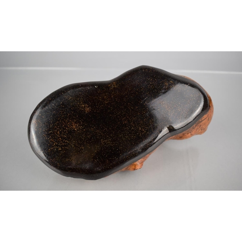 143 - A Japanese Burr and Gilt Speckled Lacquered Dish of Organic Form, 21cms by 11cms by 8cms HIgh