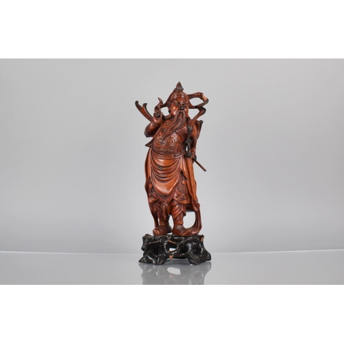 163 - A Nicely Carved Chinese Wooden and Varnished Study of Guan Yu on Pierced Naturalistic Stand, 27cms H... 