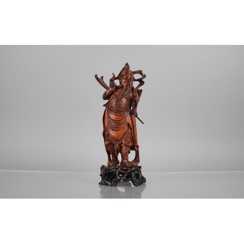 163 - A Nicely Carved Chinese Wooden and Varnished Study of Guan Yu on Pierced Naturalistic Stand, 27cms H... 