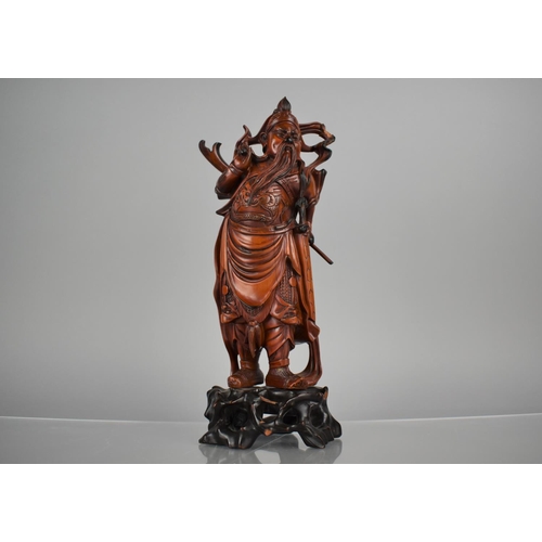 163 - A Nicely Carved Chinese Wooden and Varnished Study of Guan Yu on Pierced Naturalistic Stand, 27cms H... 