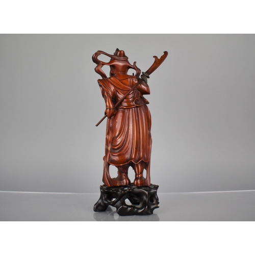 163 - A Nicely Carved Chinese Wooden and Varnished Study of Guan Yu on Pierced Naturalistic Stand, 27cms H... 