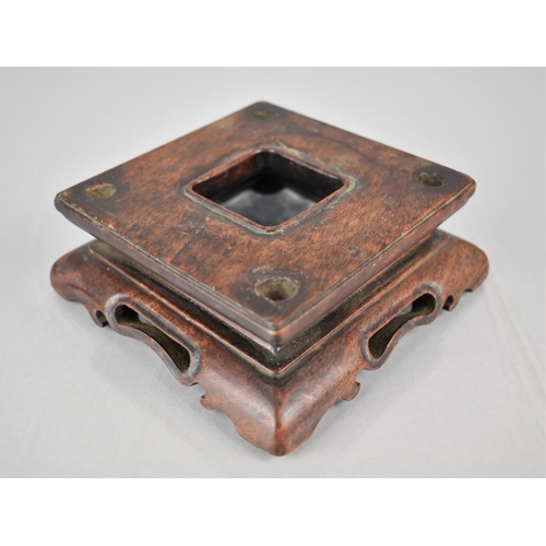 166 - A Chinese Carved and Pierced Hardwood Stand of Square Form, 10cms Square Top and 4cms High