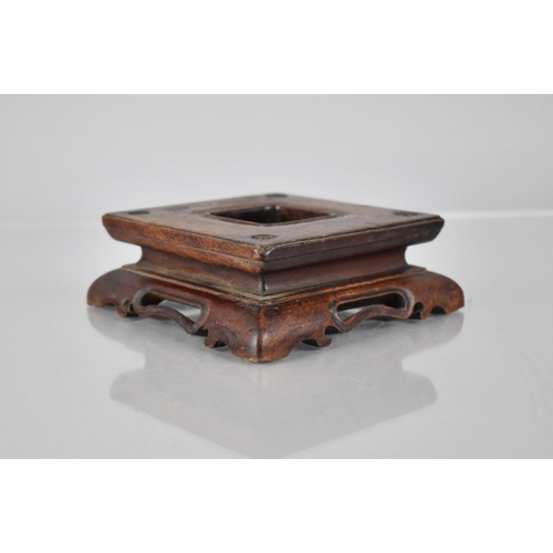 166 - A Chinese Carved and Pierced Hardwood Stand of Square Form, 10cms Square Top and 4cms High