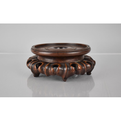 169 - A Chinese Carved and Pierced Hardwood Vase Stand to Fit 7.2cms Max Base, 5cms High