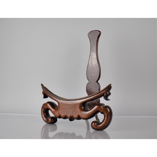 171 - A Good Quality Chinese Hardwood Plate Stand with Carved Scrolled Design, 24cms Wide and 31.5cms High