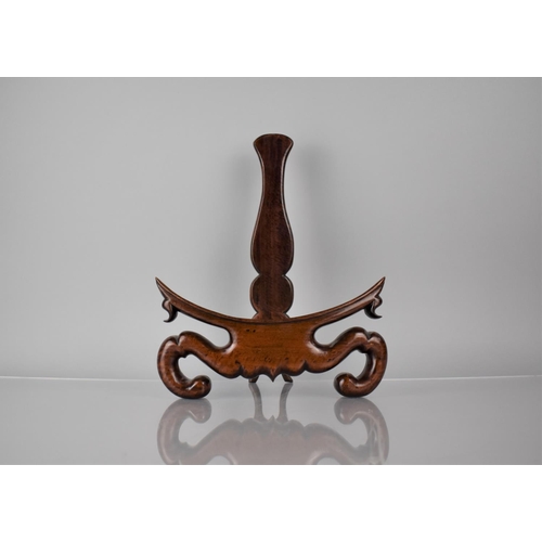 171 - A Good Quality Chinese Hardwood Plate Stand with Carved Scrolled Design, 24cms Wide and 31.5cms High