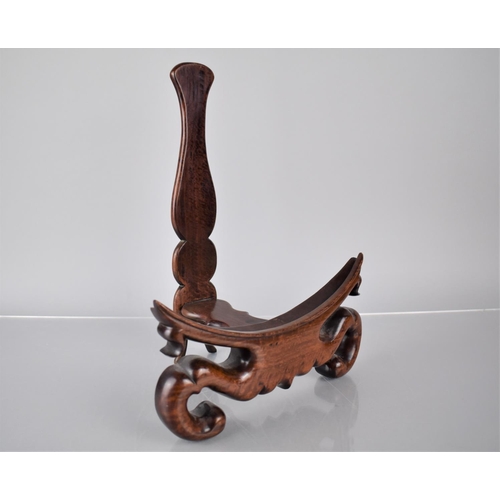 171 - A Good Quality Chinese Hardwood Plate Stand with Carved Scrolled Design, 24cms Wide and 31.5cms High