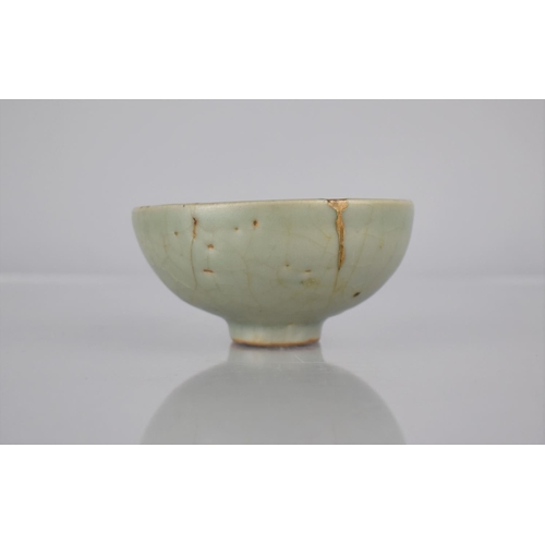 117 - A Chinese Longquan Celadon Pottery Tea Bowl, the Bowl Bottom with Flower Head Centre and Foot Reveal... 