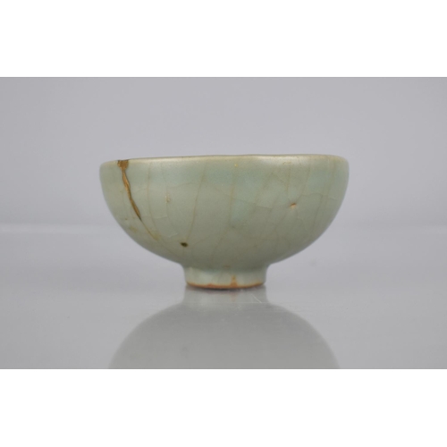 117 - A Chinese Longquan Celadon Pottery Tea Bowl, the Bowl Bottom with Flower Head Centre and Foot Reveal... 