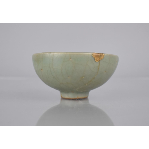 117 - A Chinese Longquan Celadon Pottery Tea Bowl, the Bowl Bottom with Flower Head Centre and Foot Reveal... 