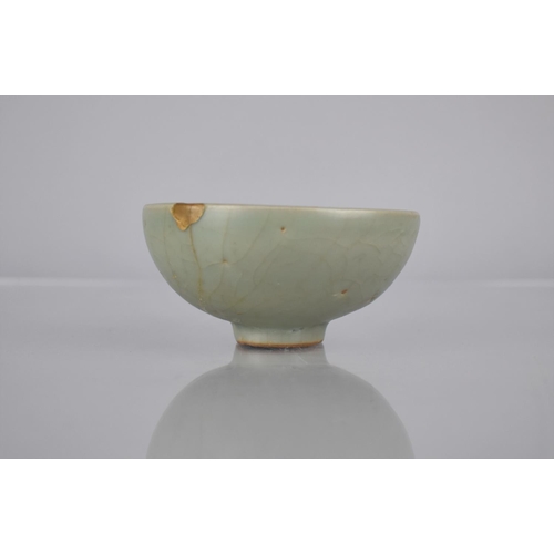 117 - A Chinese Longquan Celadon Pottery Tea Bowl, the Bowl Bottom with Flower Head Centre and Foot Reveal... 