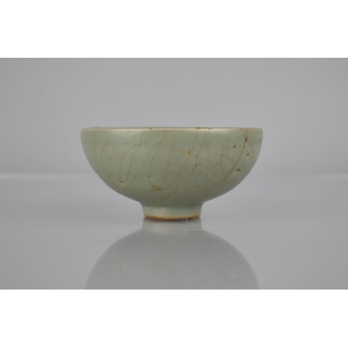 117 - A Chinese Longquan Celadon Pottery Tea Bowl, the Bowl Bottom with Flower Head Centre and Foot Reveal... 