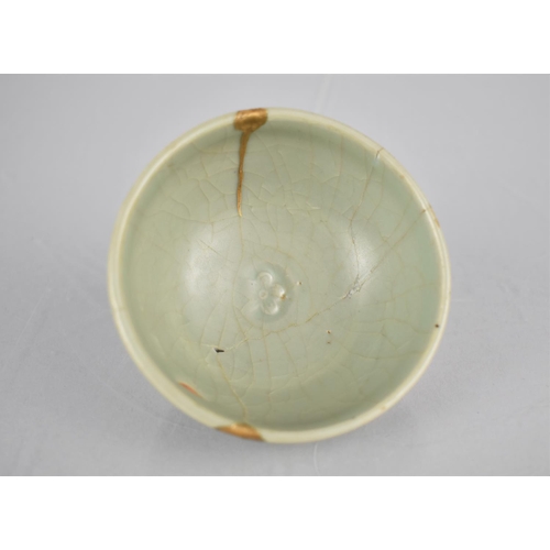 117 - A Chinese Longquan Celadon Pottery Tea Bowl, the Bowl Bottom with Flower Head Centre and Foot Reveal... 