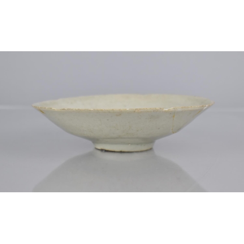 118 - A Chinese Longquan Celadon Dish with Shallow Tapering Shaped Rim and Incised Design, 14.5cm diameter... 