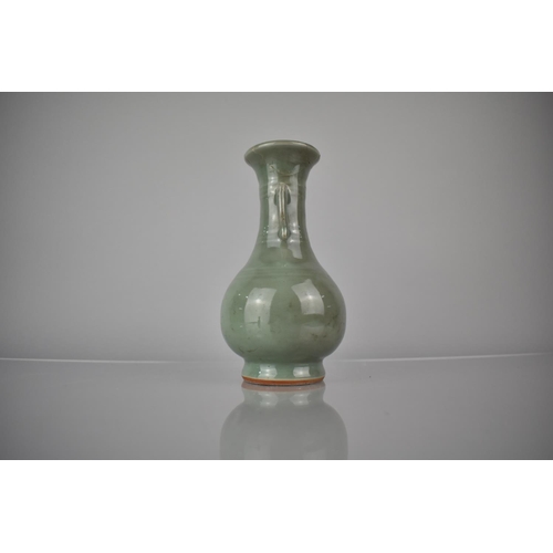 119 - A Chinese Celadon Vase of Archaic Form with Flared Rim and Tapering Neck Having Applied Twin Stylise... 