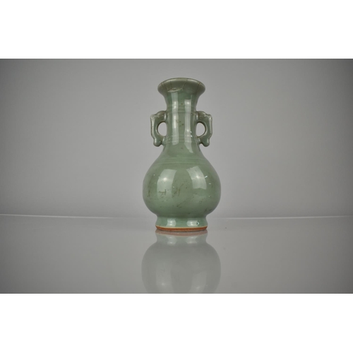 119 - A Chinese Celadon Vase of Archaic Form with Flared Rim and Tapering Neck Having Applied Twin Stylise... 