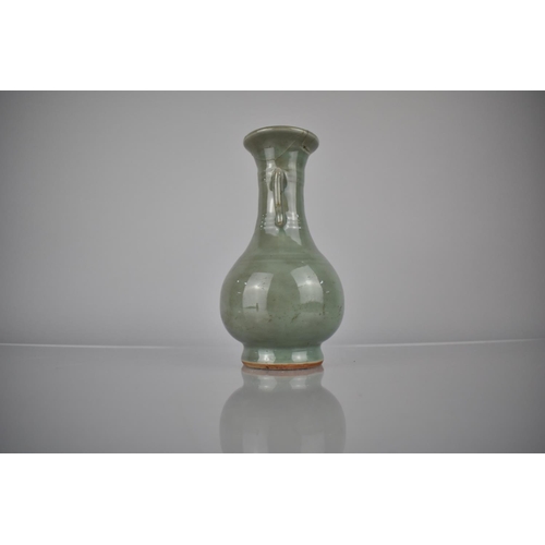 119 - A Chinese Celadon Vase of Archaic Form with Flared Rim and Tapering Neck Having Applied Twin Stylise... 