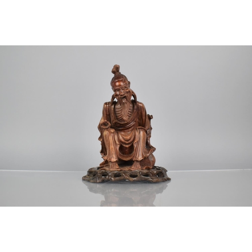 162 - A 19th Century Carved Hardwood Figure of an Emaciated Holy Man Wearing a Wide Brimmed Hat and Flowin... 