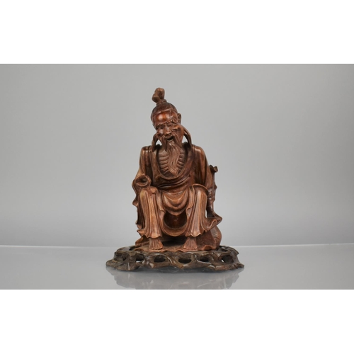 162 - A 19th Century Carved Hardwood Figure of an Emaciated Holy Man Wearing a Wide Brimmed Hat and Flowin... 