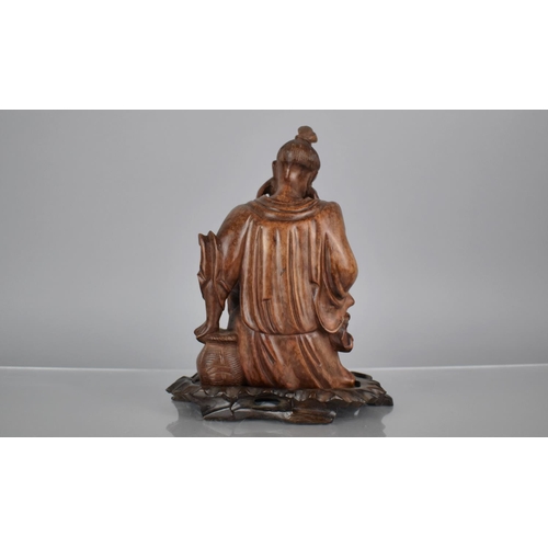 162 - A 19th Century Carved Hardwood Figure of an Emaciated Holy Man Wearing a Wide Brimmed Hat and Flowin... 