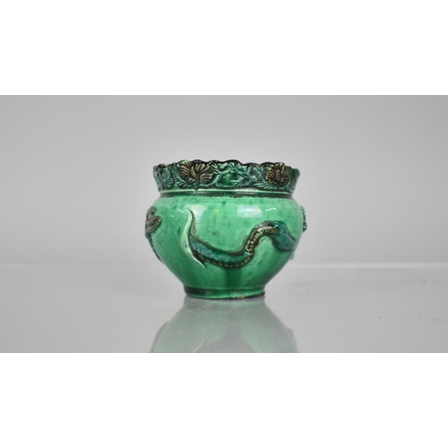 108 - A Chinese Pottery Green Glazed Pot decorated in Relief with Dragon, 6.5cms High