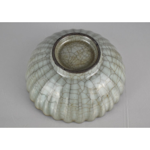 121 - A Chinese Celadon Crackle Glazed Bowl of Reeded Form, 19cms Diameter, 8cms High