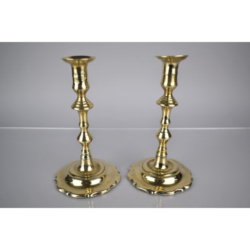 230 - A Pair of 18th Century George III Brass Candlesticks with Shaped Stems over Wavey Rococo Bases, 19cm... 