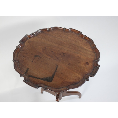 218 - An Early George III Mahogany Tripod Wine Table with a Carved Pie Crust Top over a Turned Stem and Th... 