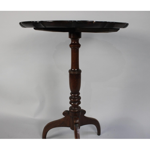 218 - An Early George III Mahogany Tripod Wine Table with a Carved Pie Crust Top over a Turned Stem and Th... 