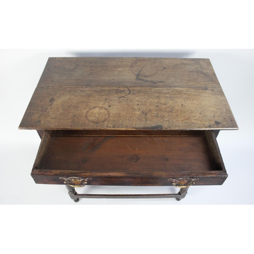 195 - An Early 18th Century Country Made Oak Side Table with a Solid Plank Top Over a Frieze Drawer, Suppo... 