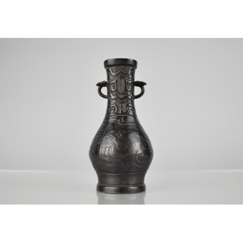 175 - A Chinese Bronze Vase of Archaic From with Tapering Neck having Twin Lug Handles and Ruyi Shoulders,... 