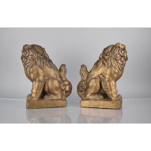 185 - A Pair of Two Heavy Gilt Cast Plaster Studies of Temple Lions, 25cms High